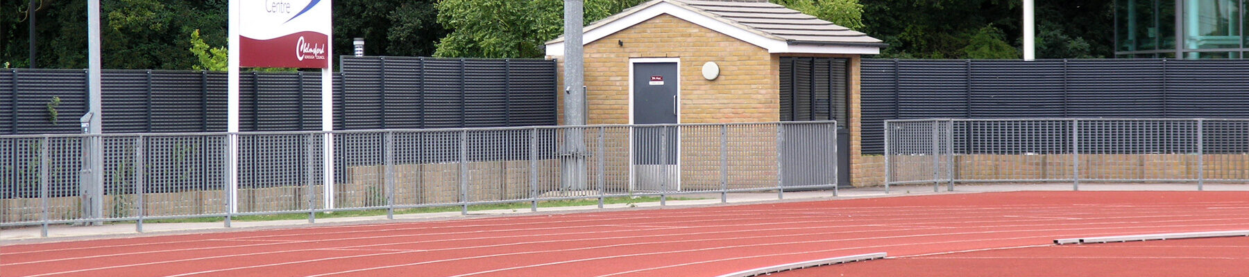 louvred fence provides visual screening at sports and athletics club