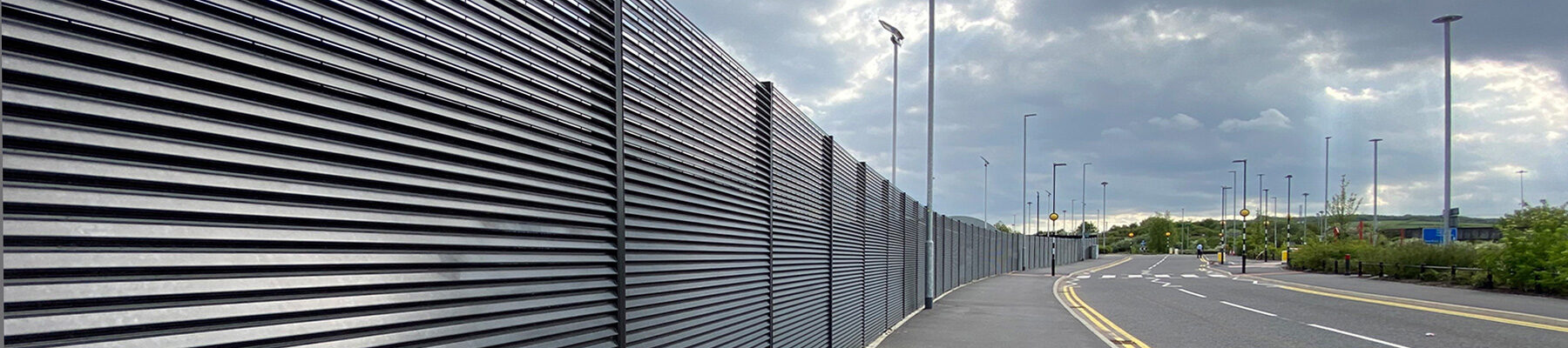 Steel louvred fencing for screening coach park at Leeds United Football Club