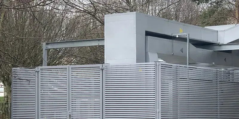 Acoustic louvred compound Dundee University 3 20240411 144637032 iOS copy Secure steel louvred compound with acoustic panels around HVAC equipment at Dundee University